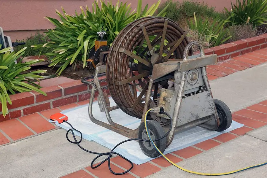 Heavy-duty drain cleaning machine outdoors